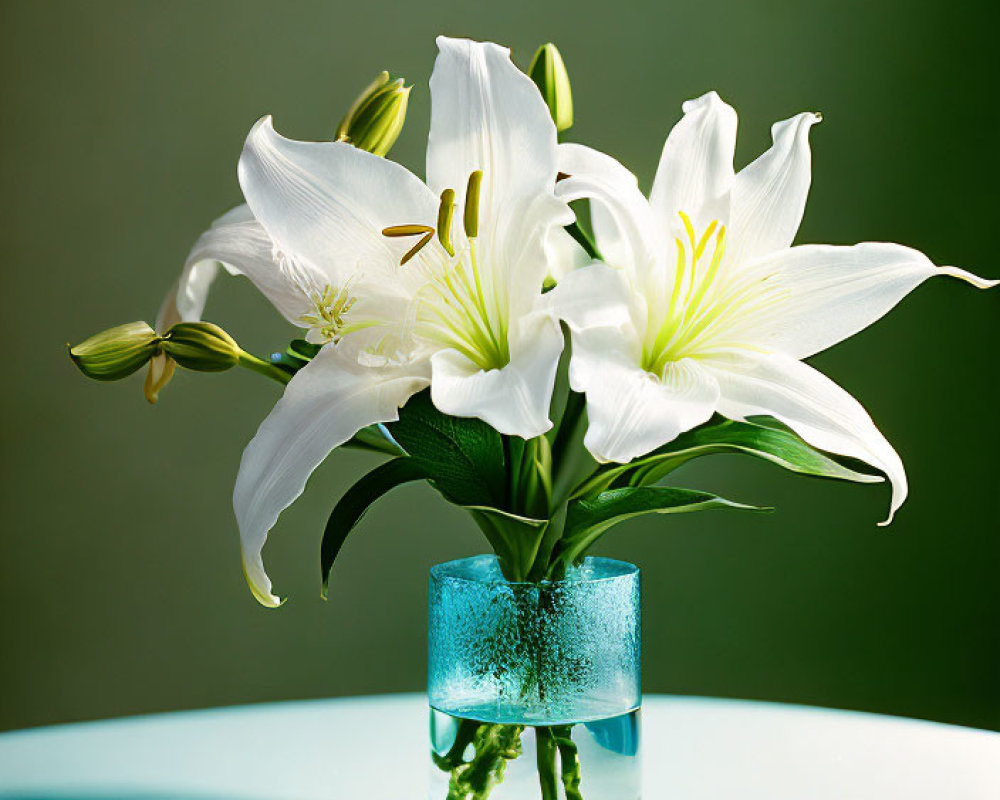 White Lilies in Blue Glass Vase on Table with Soft Green Background