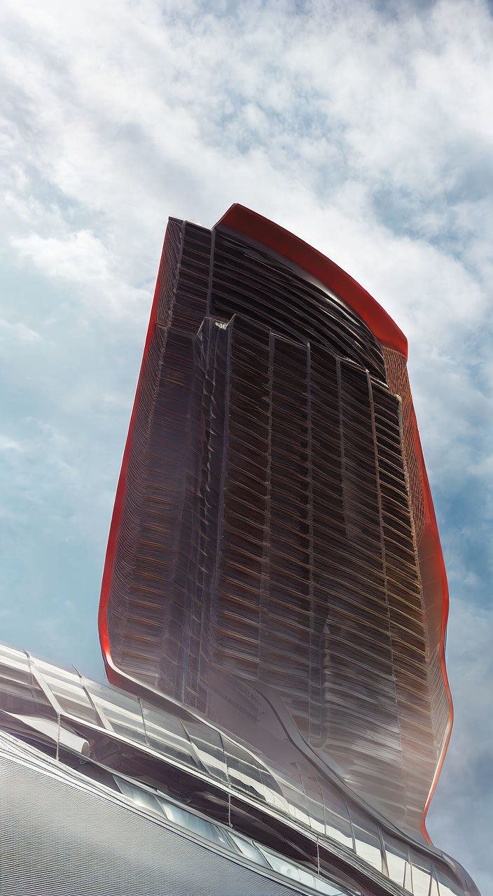 Modern high-rise building with red top and vertical louvers under blue sky