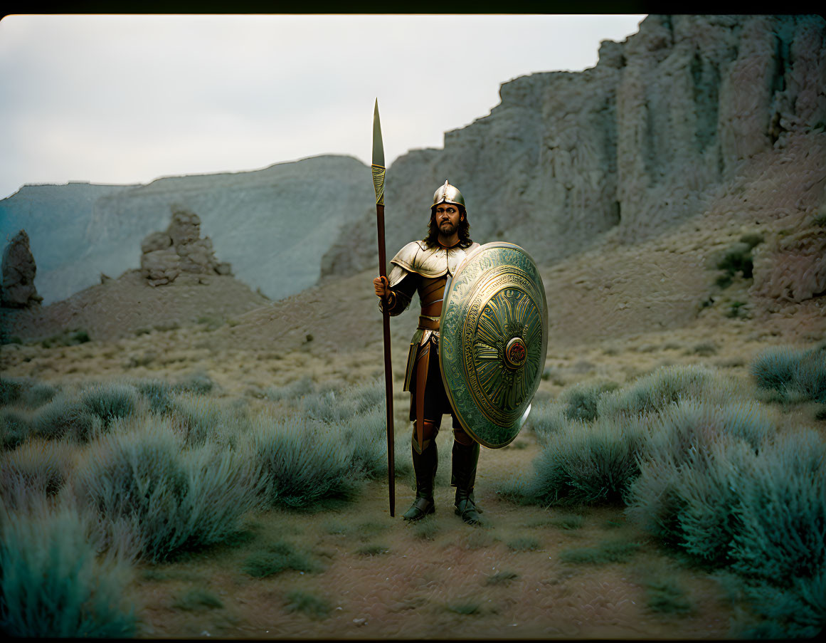 Ancient warrior in desert landscape with spear and shield