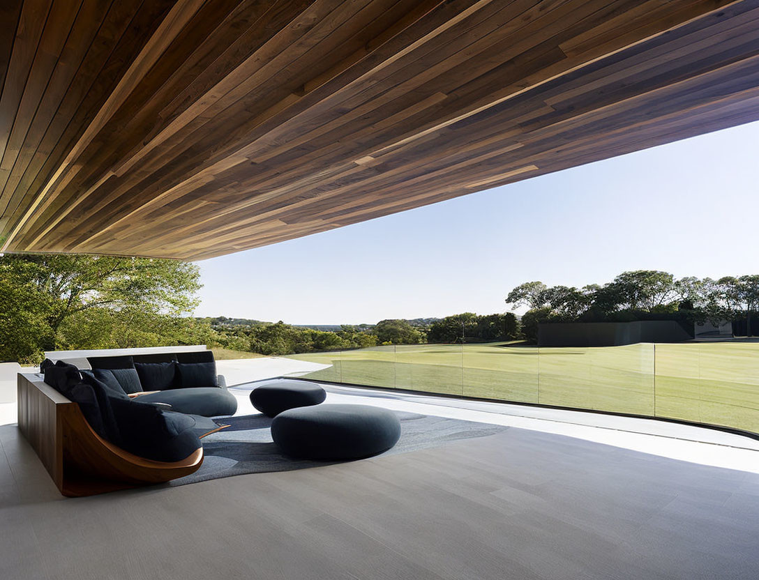 Modern Terrace with Elegant Wooden Ceiling and Panoramic Grass Landscape View