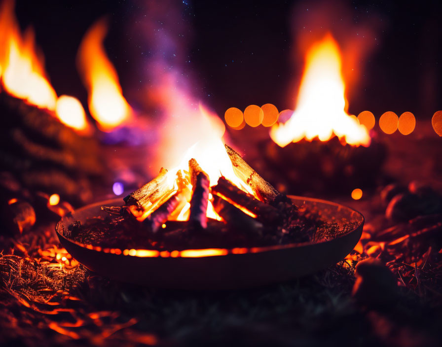 Small Campfire Close-Up with Glowing Embers and Bokeh Lights