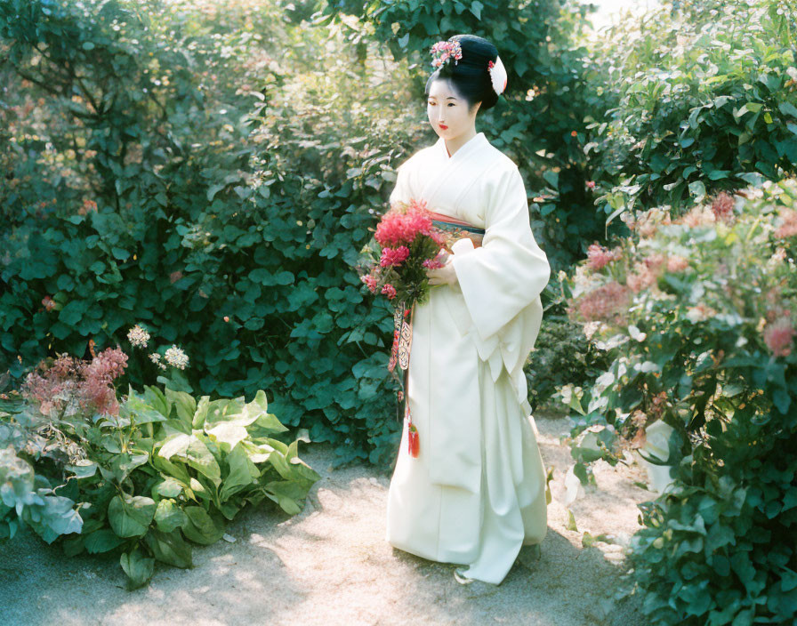 Traditional Japanese Attire Woman with Pink Flowers in Greenery