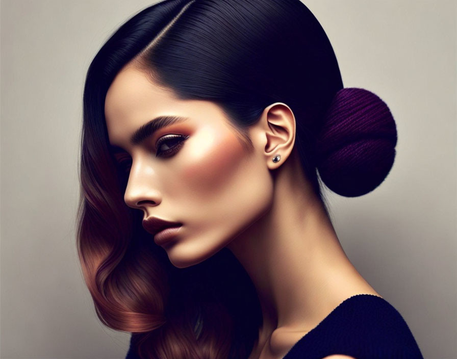 Brunette woman portrait with side bun and highlighted cheeks