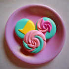 Colorful Swirled Meringue Cookies on Pink Plate