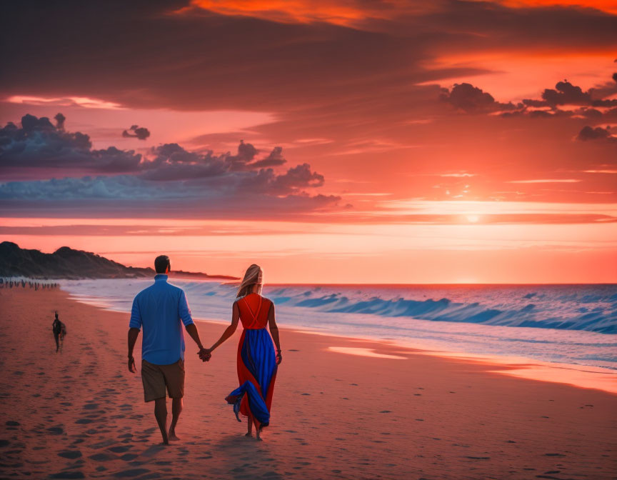 Couple walking on beach at sunset with vibrant orange skies and gentle waves
