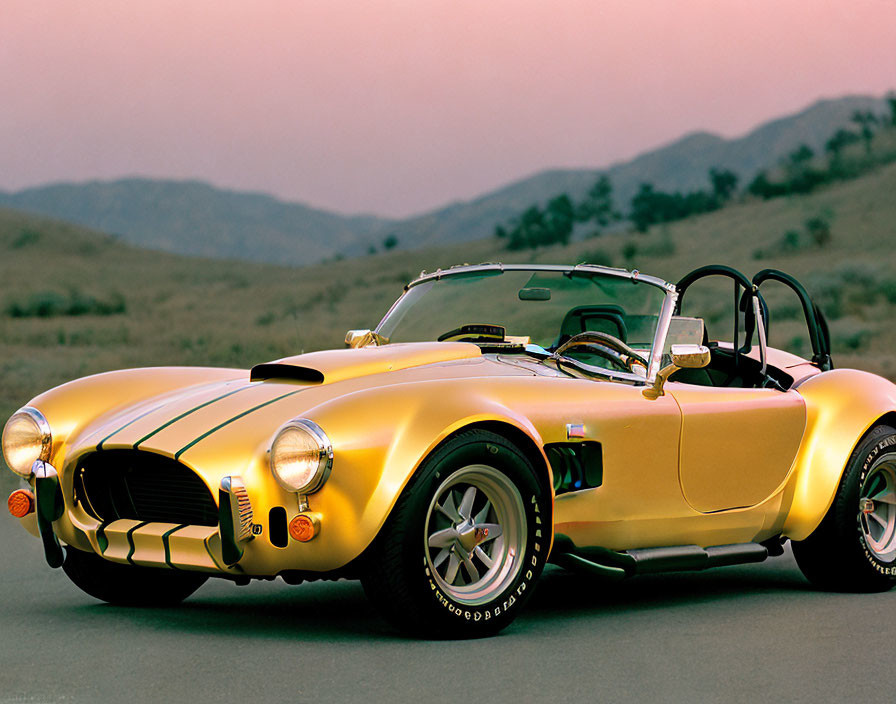 Vintage yellow sports car with black racing stripes on road at dusk