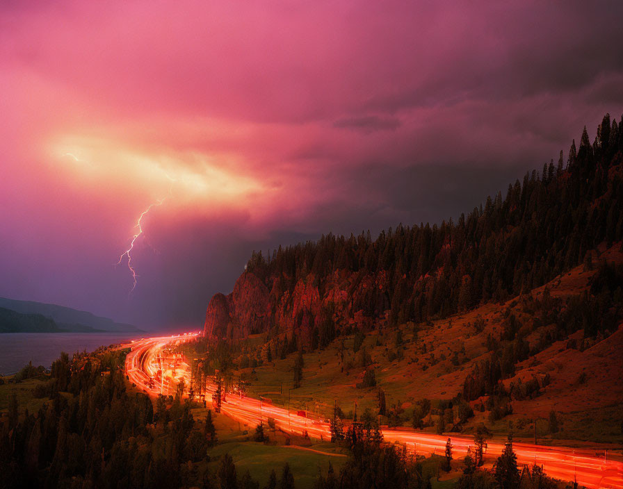 Dramatic lightning strike in stormy sky over forested road