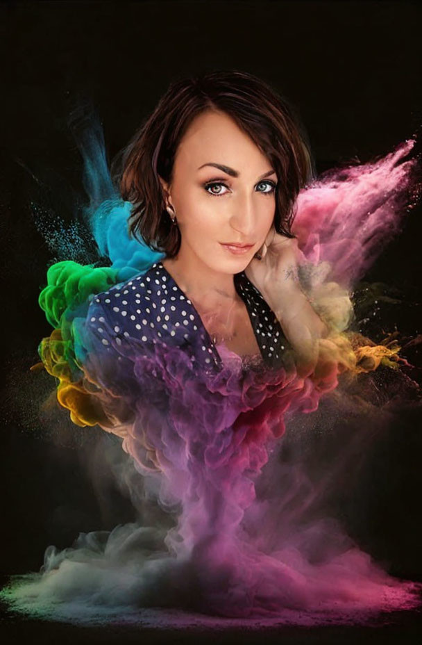 Short-haired woman surrounded by vibrant colored dust on dark background