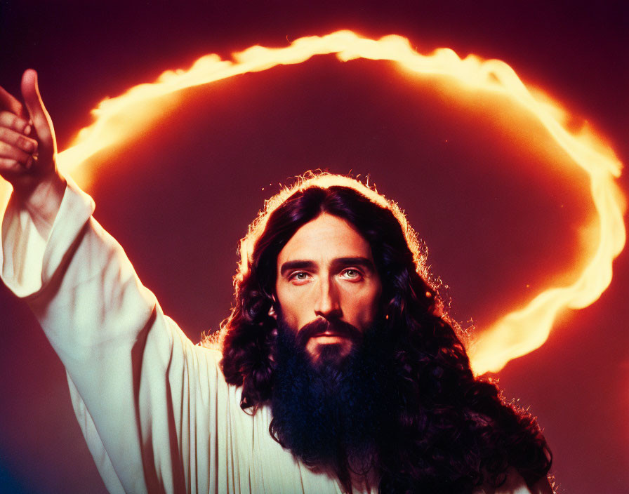 Bearded man in white robe with fiery halo on red background