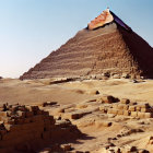 Ancient pyramid with partial capstone in desert ruins