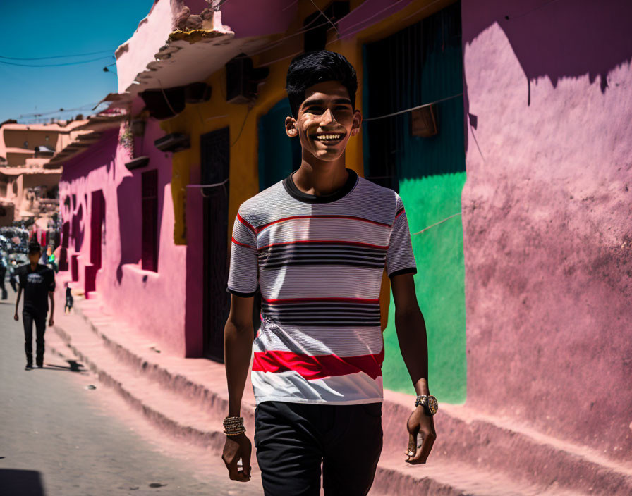 Smiling Young Man Walking in Vibrant Street