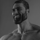Muscular bearded man smiling in monochrome portrait