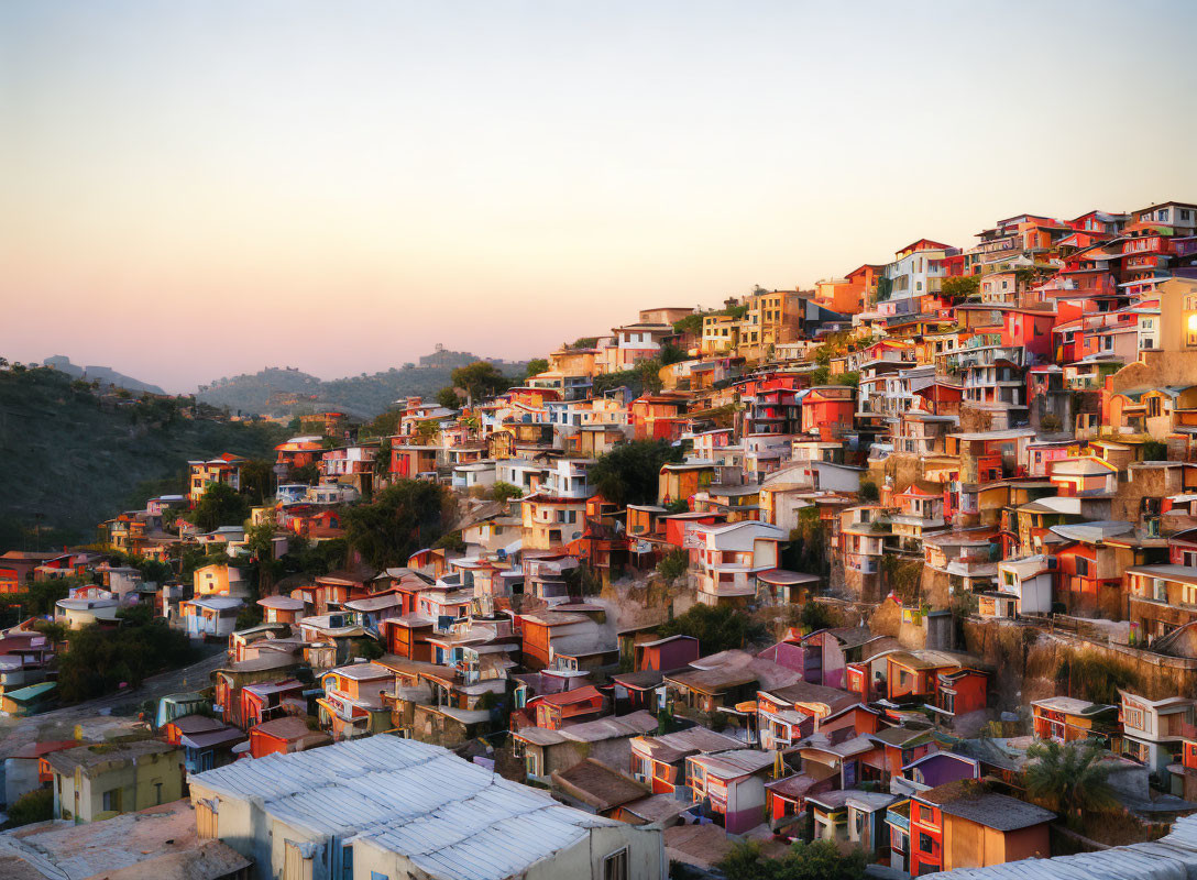 Colorful Hillside Town Sunset with Tiered Houses & Lush Vegetation
