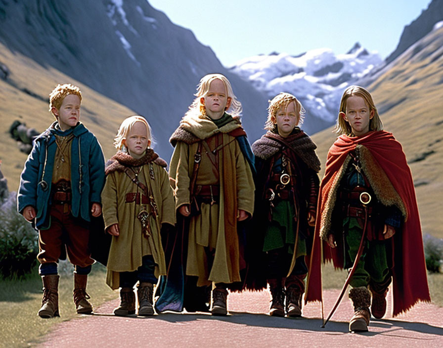 Four Young Actors in Fantasy Character Costumes with Mountain Background