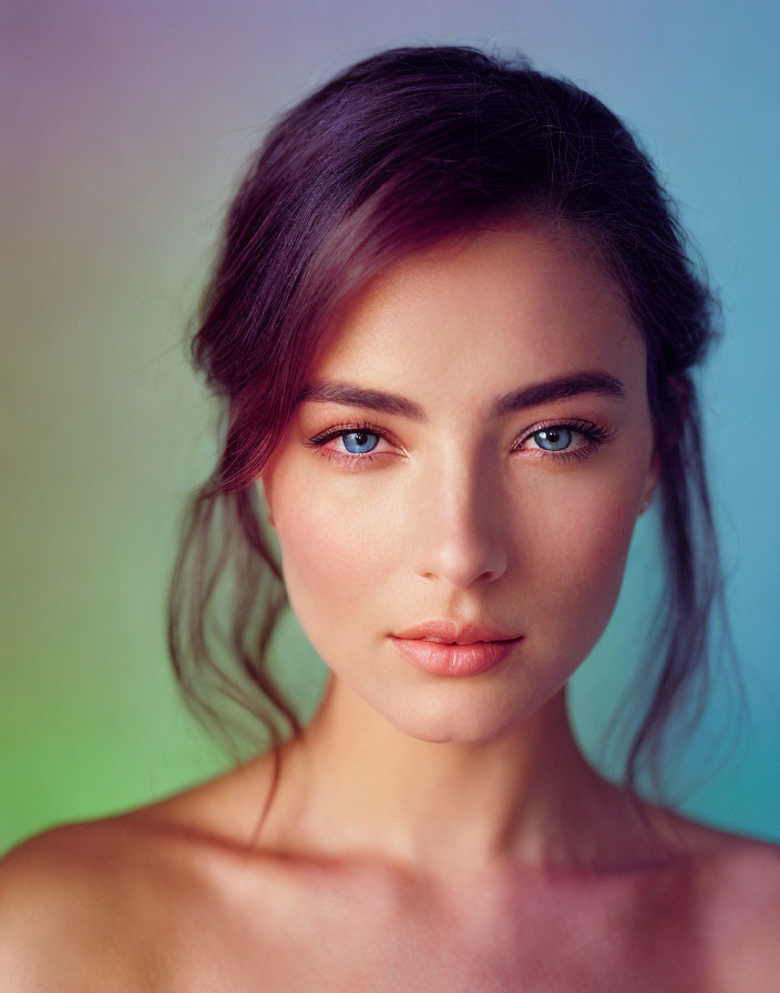 Young Woman Portrait with Blue Eyes and Dark Hair on Pastel Background