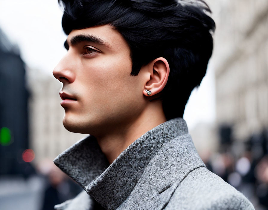 Man with Dark Hair in High-Collared Gray Coat and Stud Earring