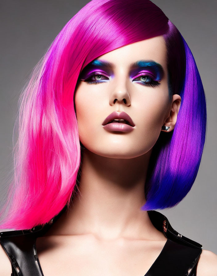 Striking Magenta and Pink Hair Model in Purple Eyeshadow and Leather Outfit