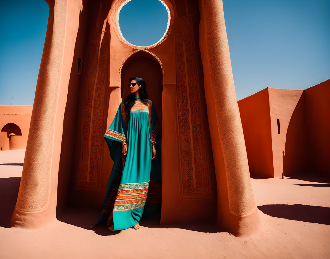 Woman in Teal Dress Beside Terracotta Archway