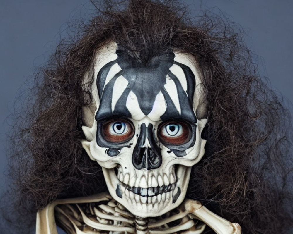 Intense skeleton makeup and wild hair on grey background