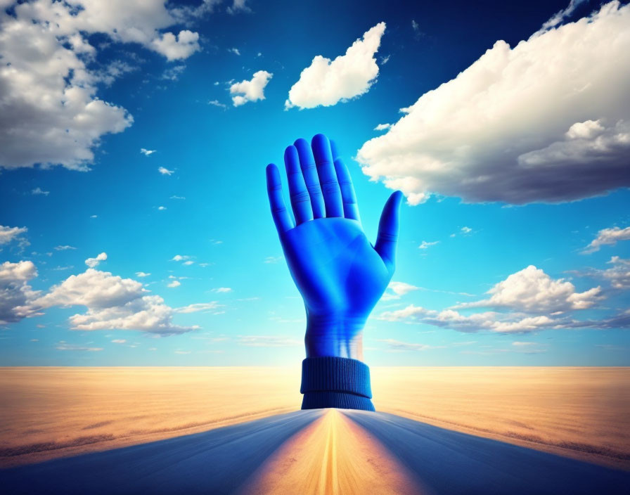 Enormous blue hand emerging in desert landscape