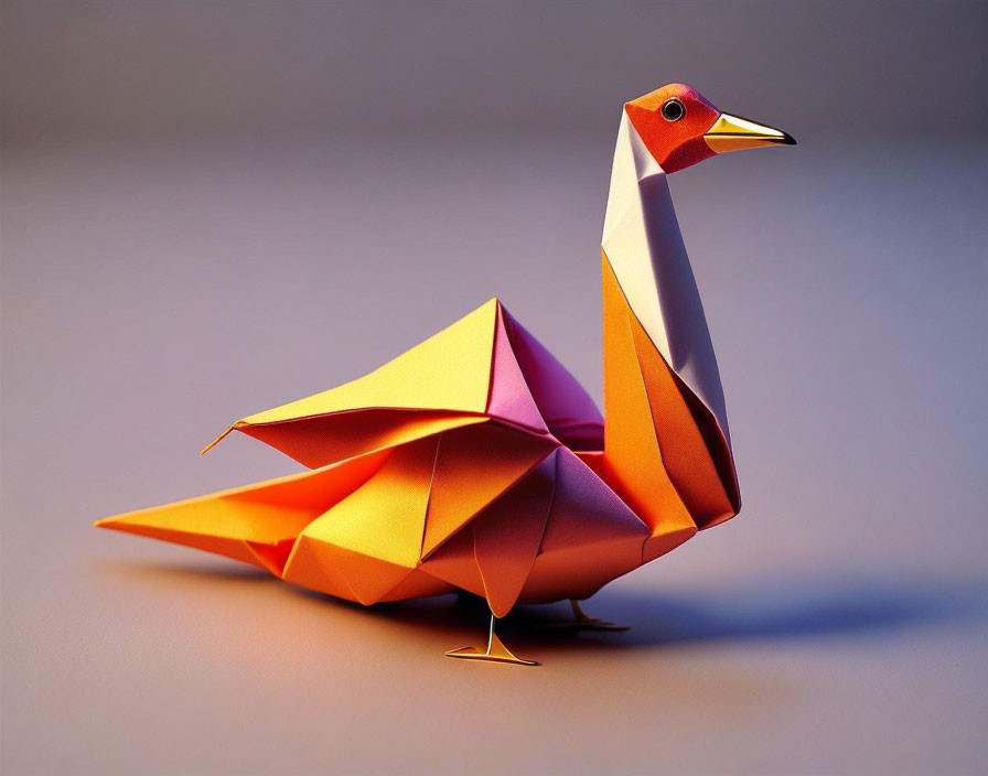 Colorful Origami Swan: Orange Body, Pink Wings, Gray Background