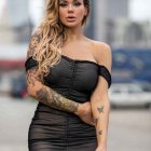 Illustrated female figure with intricate tattoos, black strapless dress, stylized hair, and blurry vertical