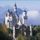 Castle with Multiple Spires on Misty Mountaintop