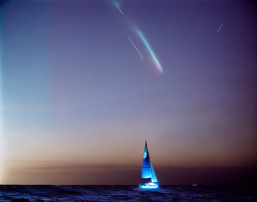 Blue sailboat glows at night on open sea under starry sky & meteor shower