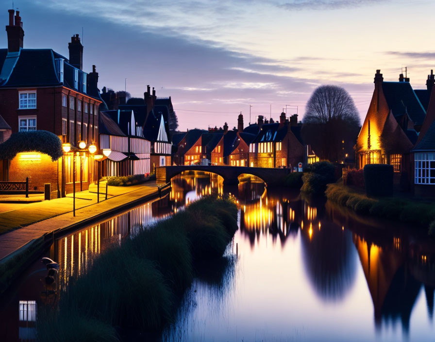 Serene canal at twilight with illuminated street lamps and picturesque houses
