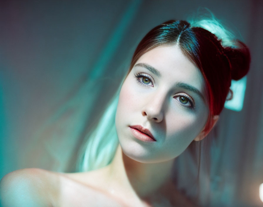 Woman with Headband Gazing in Blue-Lit Room