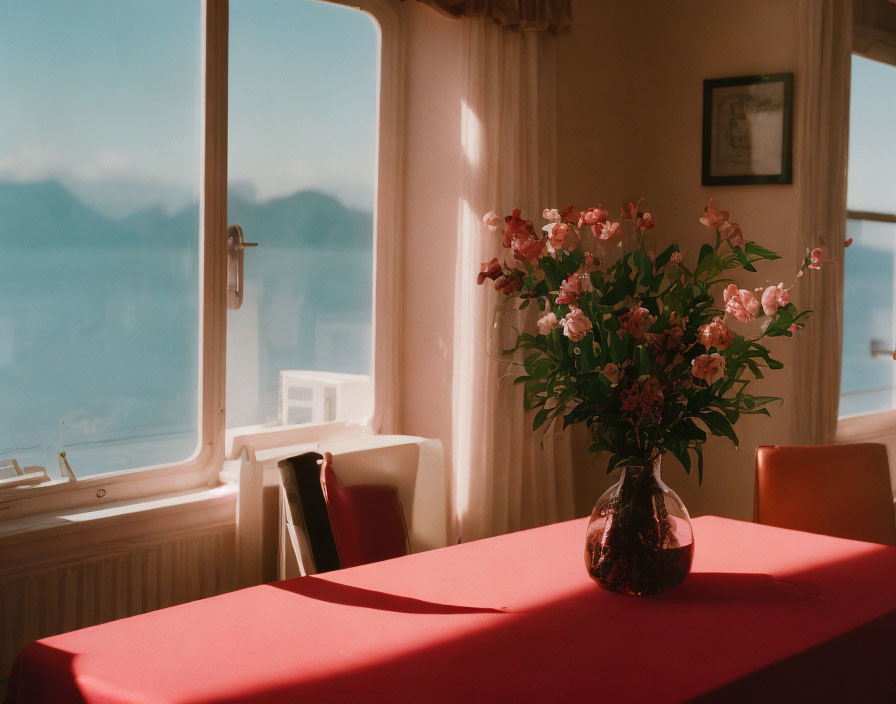 Sunlit Room with Flowers on Table, Red Cloth, Mountain View