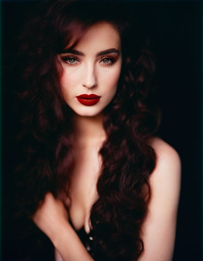 Portrait of Woman with Long Curly Hair and Red Lipstick