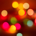 Colorful Blurred Christmas Lights and Snowflakes on Festive Background