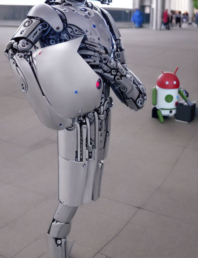 Futuristic robotic humanoid head with intricate mechanical parts and green Android mascot in modern setting