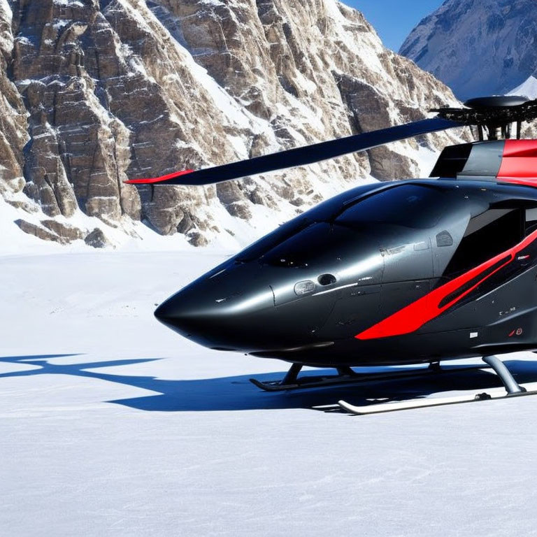 Black Helicopter with Red Accents on Snowy Landscape with Mountains