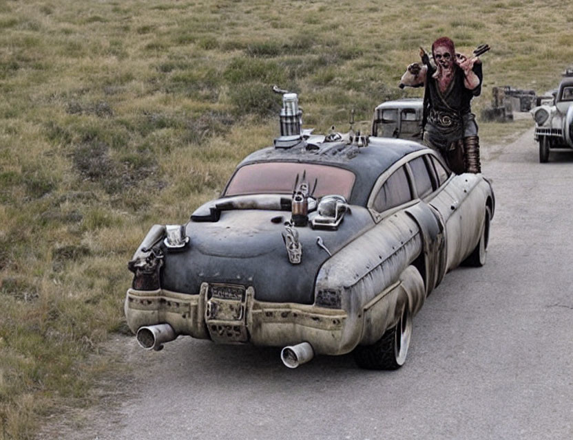 Person in Face Paint on Retrofitted Vehicle in Barren Landscape