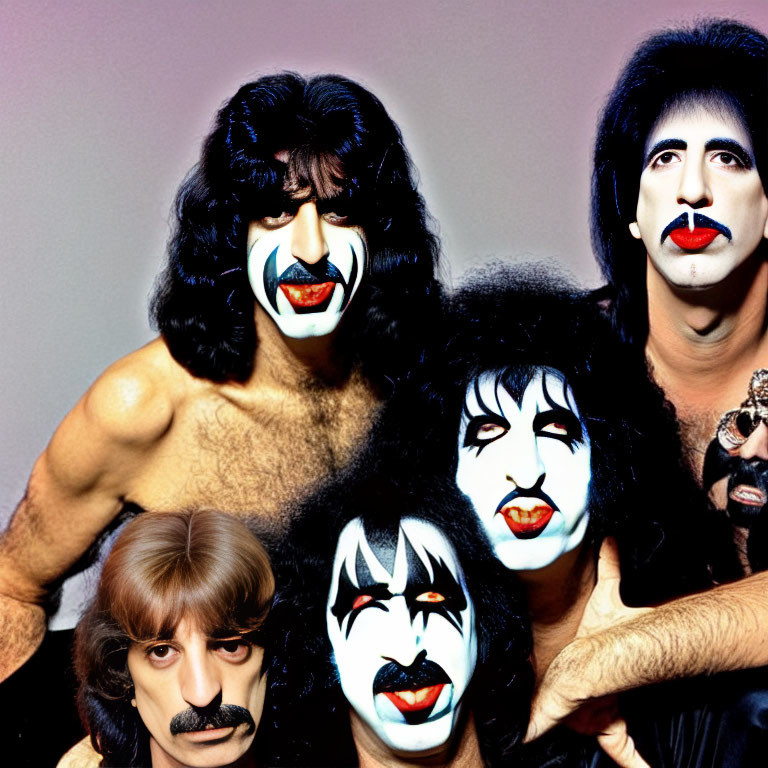 Group of four individuals in KISS-style makeup, one person without makeup.