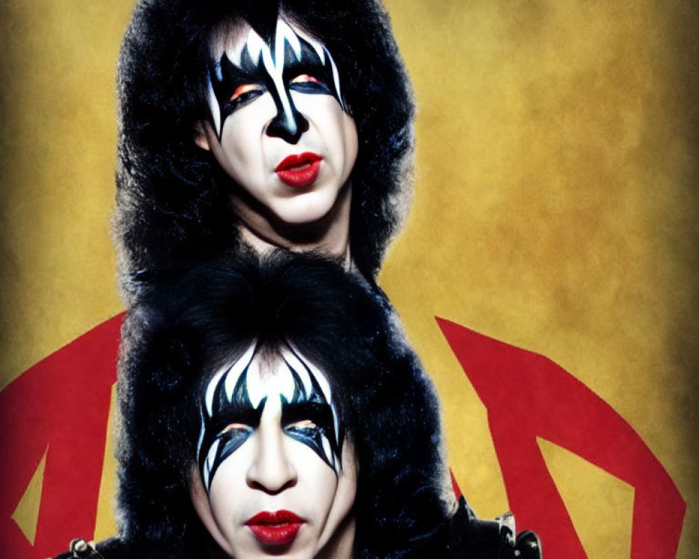 Black and white KISS-inspired face paint on two people against yellow backdrop with red logo