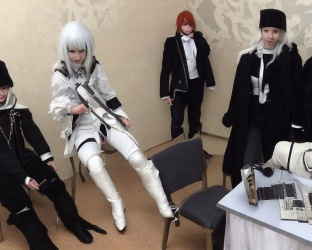 Group of Five Cosplayers in Futuristic Black and White Costumes with Electronic Parts