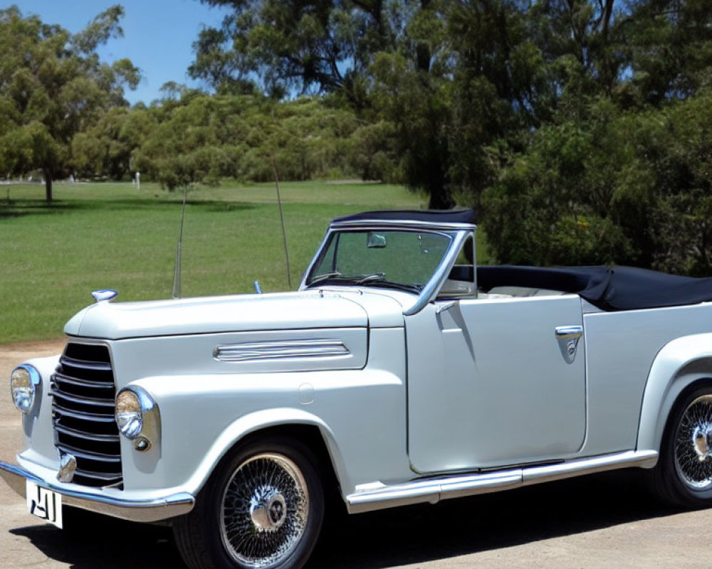 Classic White Convertible Car with Spoke Wheels and Chrome Grille