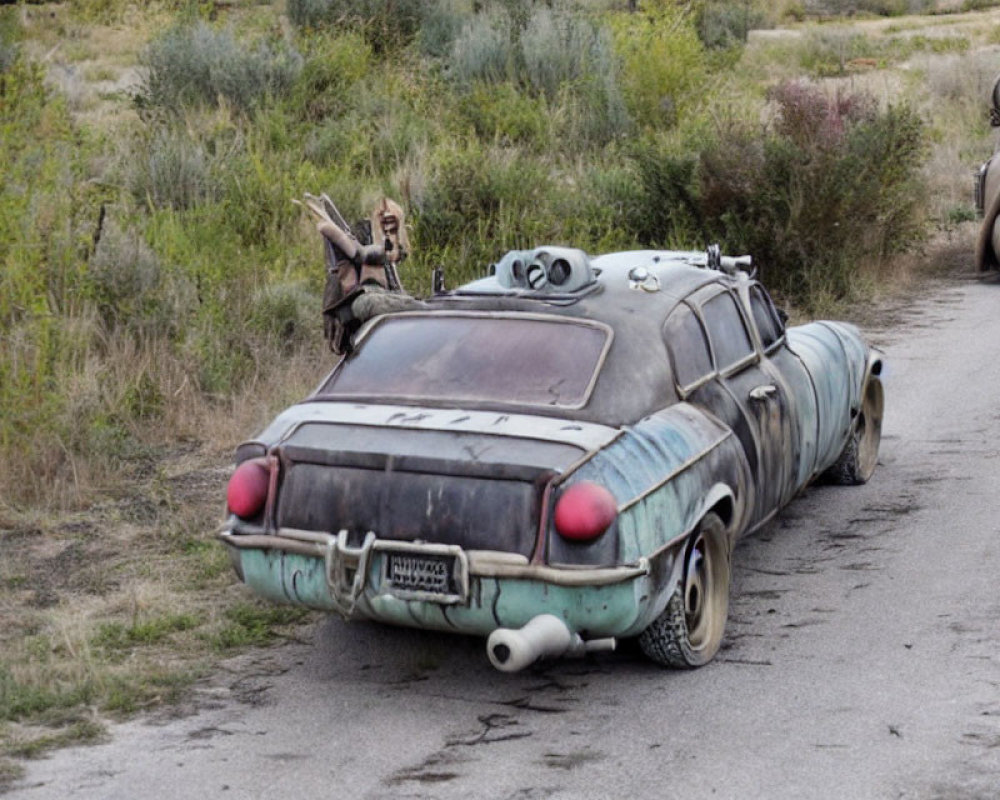 Vintage car with quirky modifications parked on dirt road