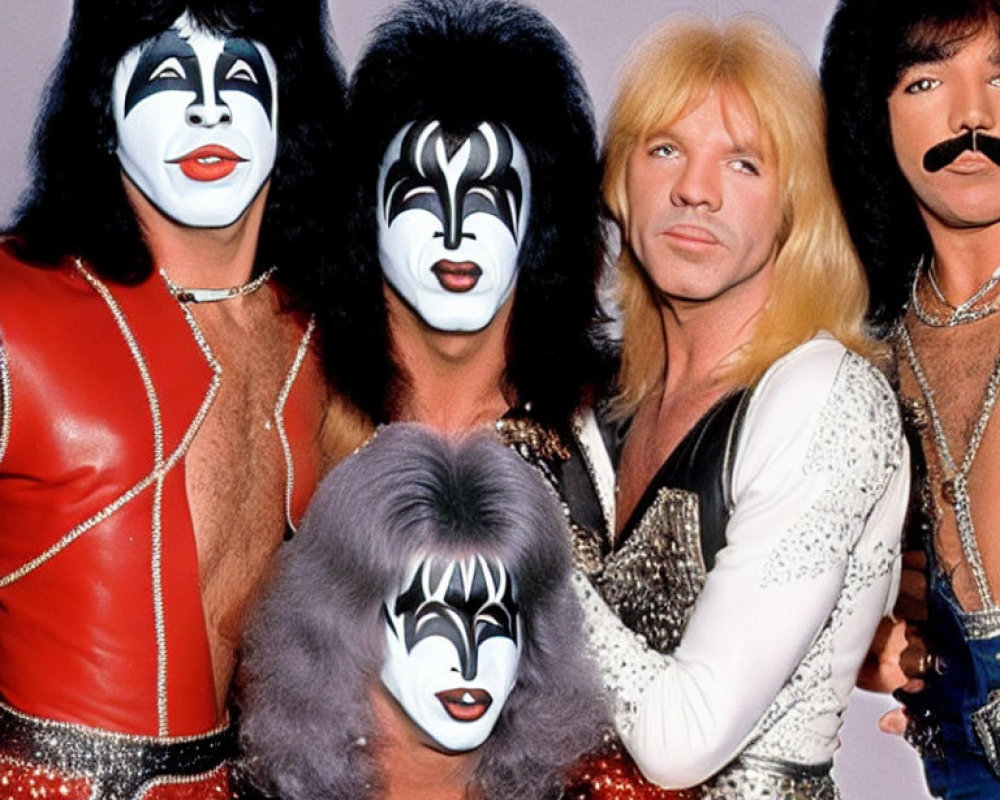 Group of Four Individuals in Glam Rock Makeup and Costumes