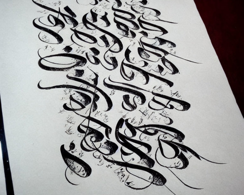 Detailed Black Calligraphy Artwork on White Paper