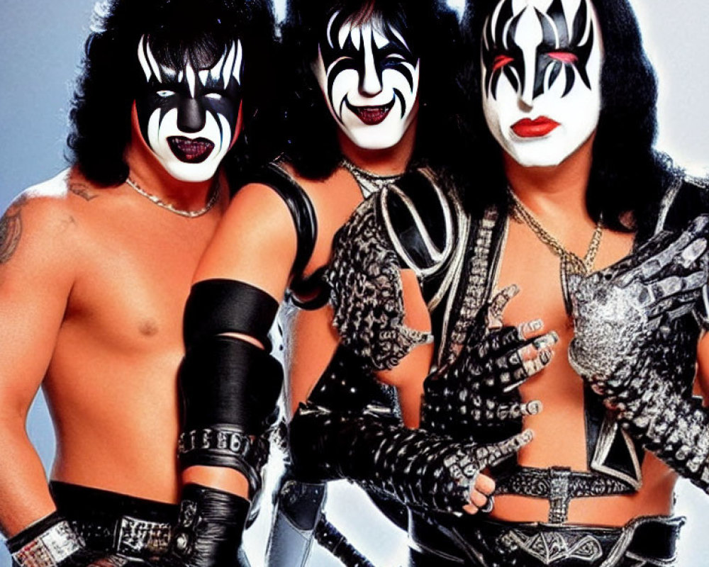 Three individuals in KISS-inspired face paint and rock attire.
