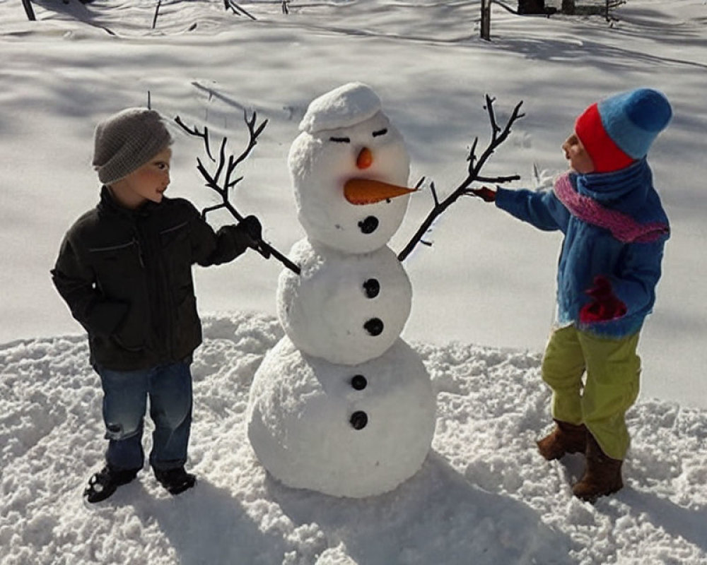 Children in winter attire beside snowman in snowy landscape