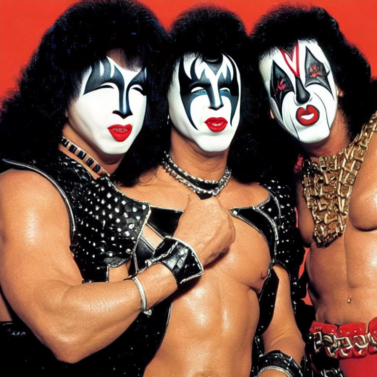 Band KISS members in iconic face paint and stage outfits on red background