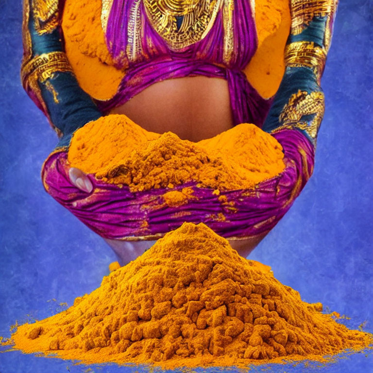 Person's Cupped Hands Covered in Orange Powder with Purple and Blue Traditional Clothing