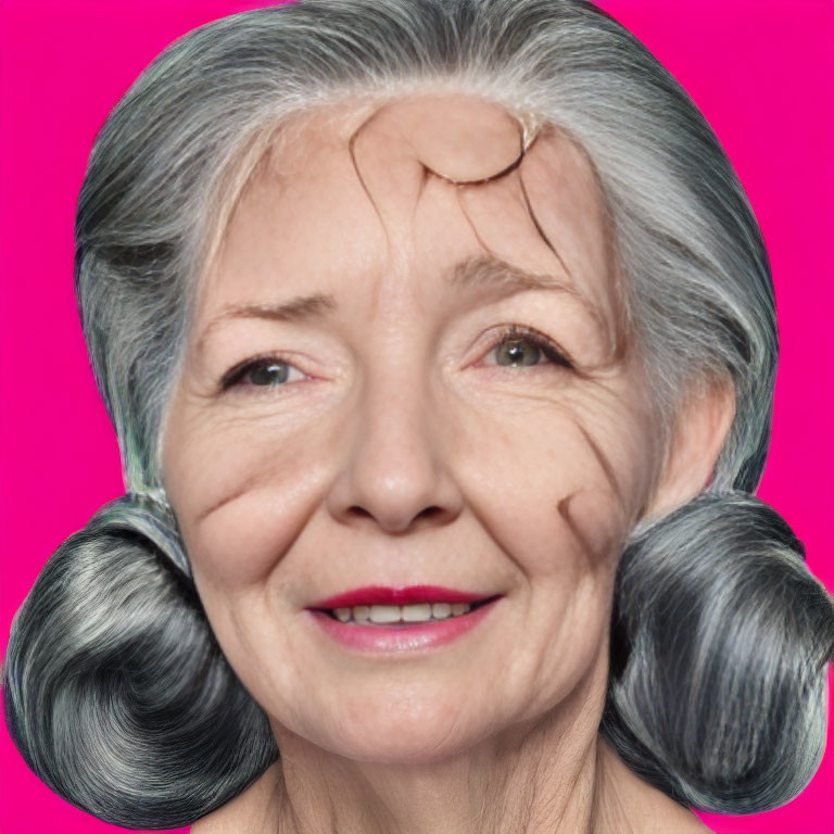 Smiling elder woman with gray hair in round buns on pink background