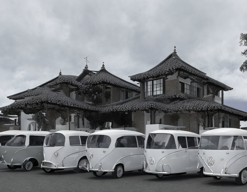Vintage white vans parked in front of Asian-style building with intricate roofing under overcast sky