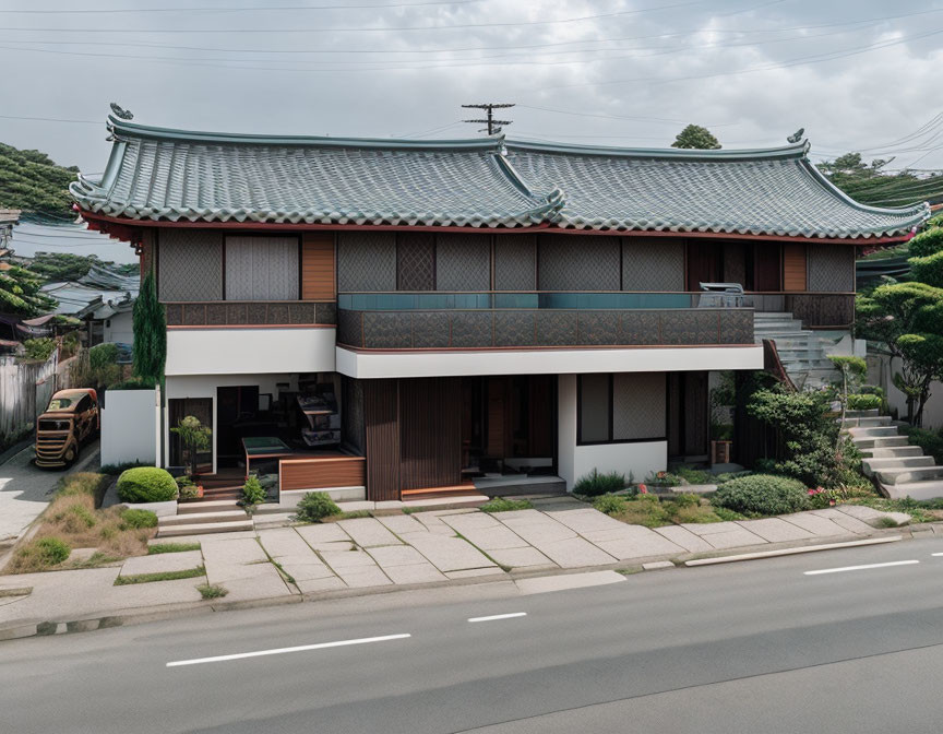 Traditional Japanese architecture with tiled roof and balcony beside parked car